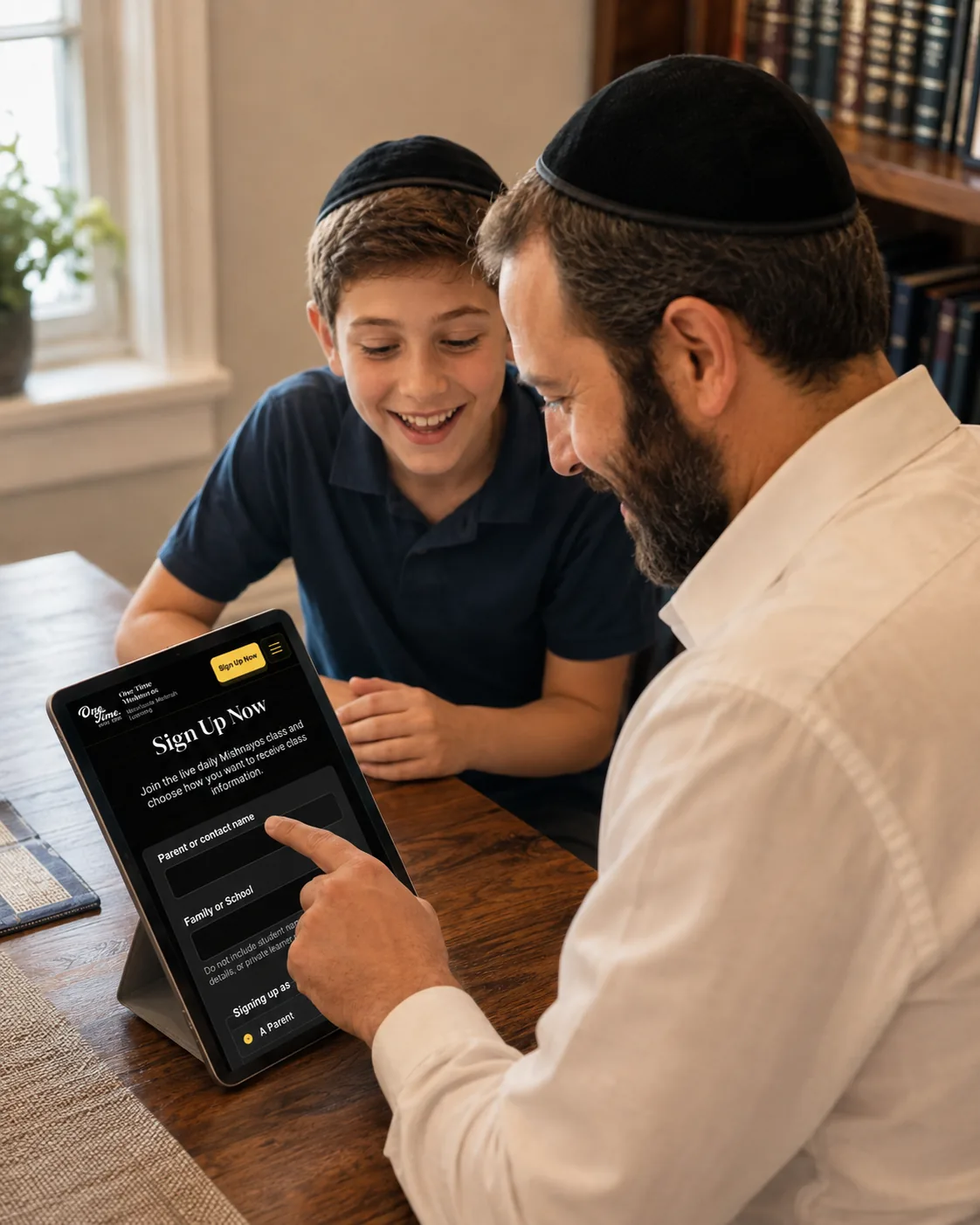 A father completing the first step of a family learning signup on a tablet